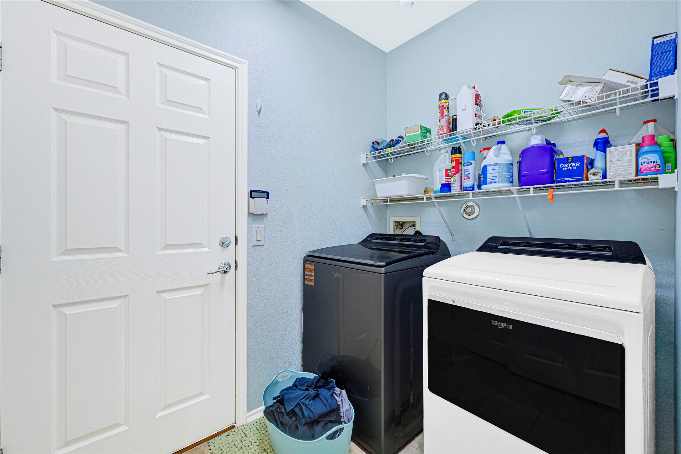 13600 Breton Ridge Street, Unit 4A Houston, TX 77070 - Photo 34 of 49 Laundry area with hanging storage and independent washer and dryer