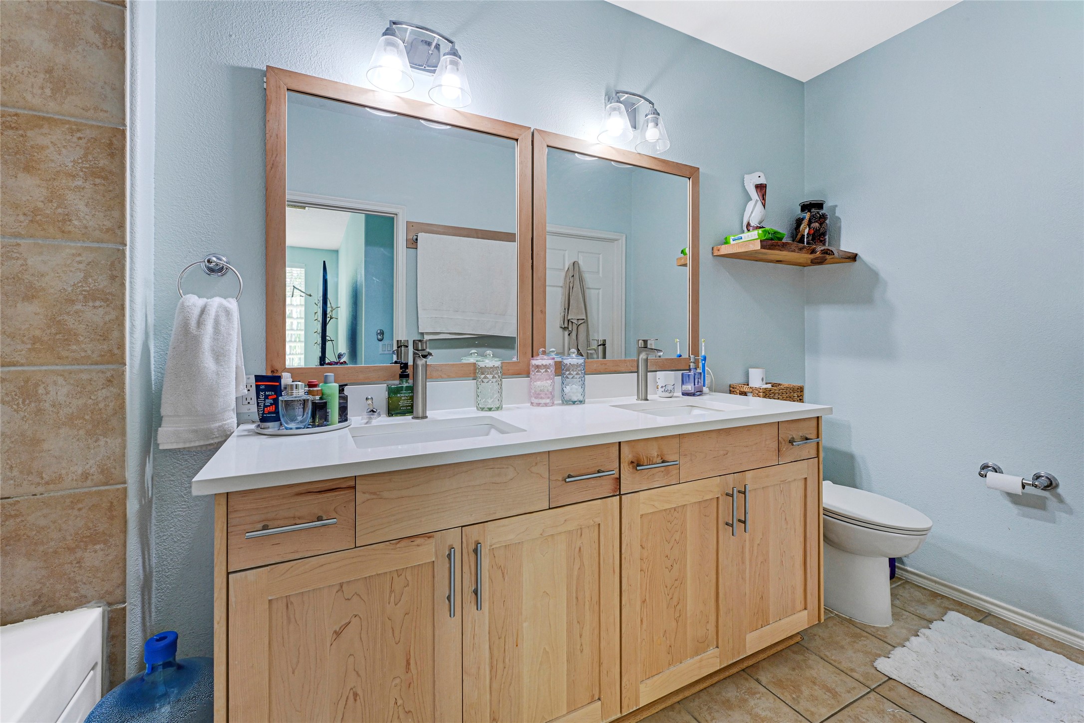 13600 Breton Ridge Street, Unit 4A Houston, TX 77070 - Photo 4 of 49 Well-sized bath with dual vanity and storage underneath