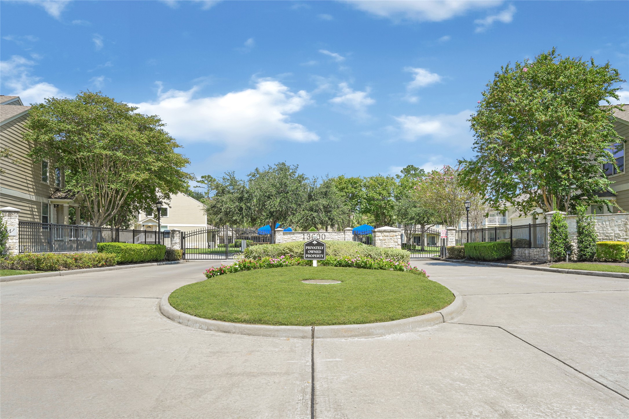 13600 Breton Ridge Street, Unit 4A Houston, TX 77070 - Photo 48 of 49 Community exterior showcasing well-kept grounds and secure environment