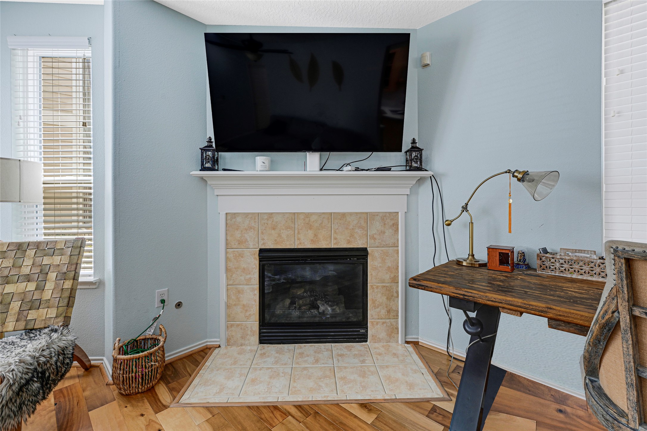 13600 Breton Ridge Street, Unit 4A Houston, TX 77070 - Photo 10 of 49 Living room anchored by a fireplace, creating a welcoming focal point