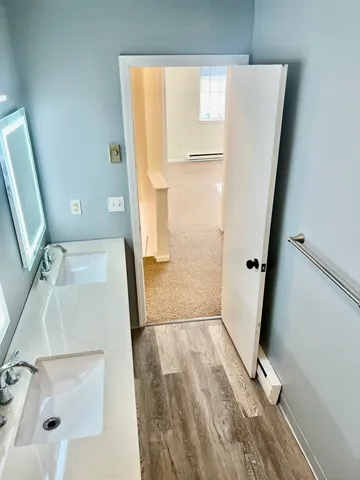 a view of front door with wooden floor