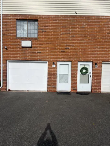 a view of a blue building with windows