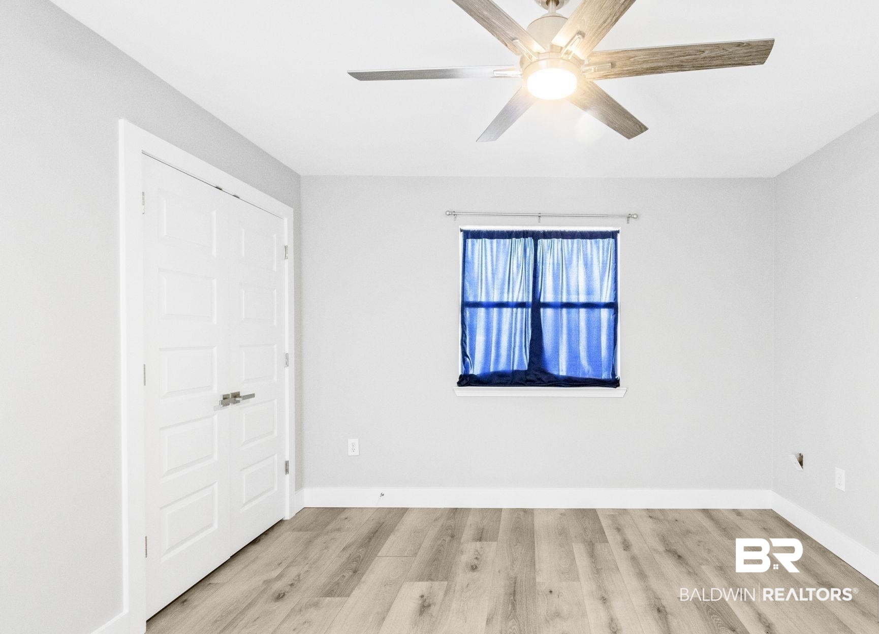25861 Canal Road, Unit 77 Orange Beach, AL 36561 - Photo 31 of 48 Unfurnished bedroom featuring light wood-type flooring and ceiling fan
