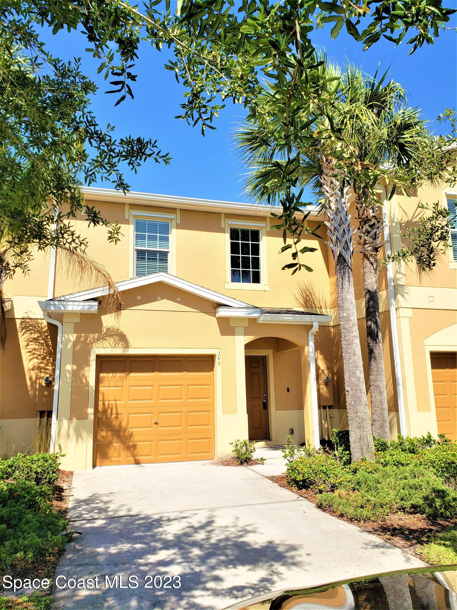 2575 Revolution Street, Unit 105 Melbourne, FL 32935 - Photo 1 of 38 a front view of a house with a garden