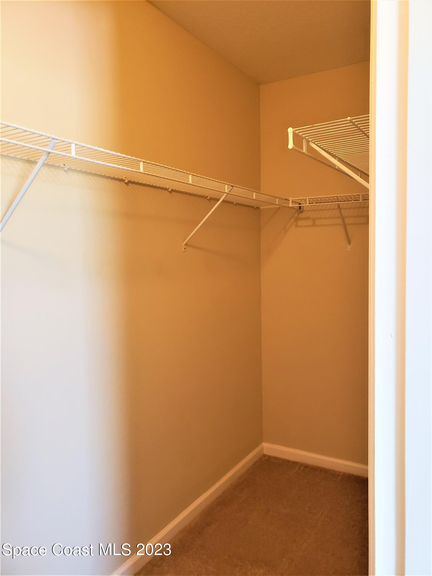 2575 Revolution Street, Unit 105 Melbourne, FL 32935 - Photo 18 of 38 a view of small space with racks on the wall