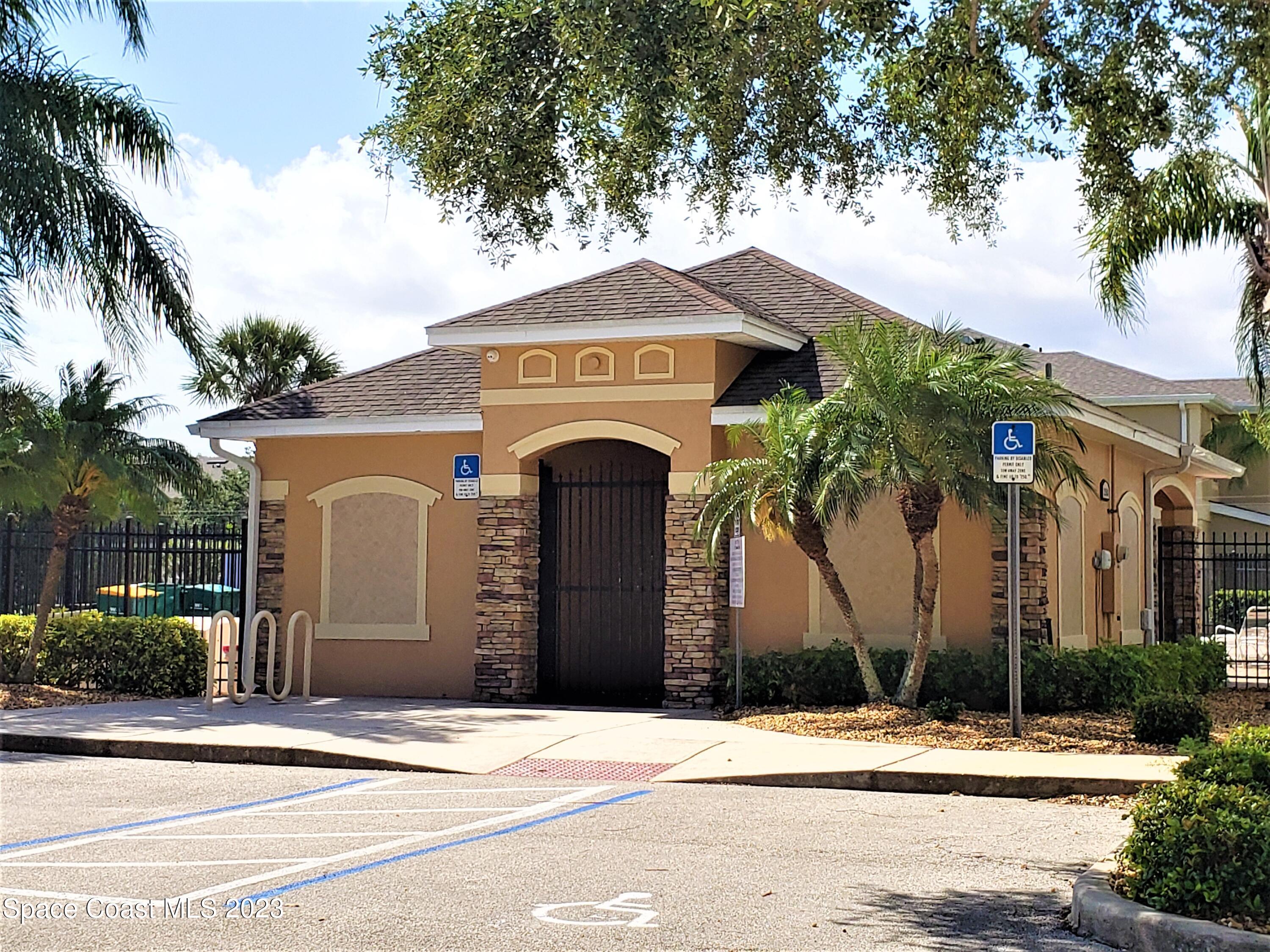 2575 Revolution Street, Unit 105 Melbourne, FL 32935 - Photo 26 of 38 a front view of a house with a garden
