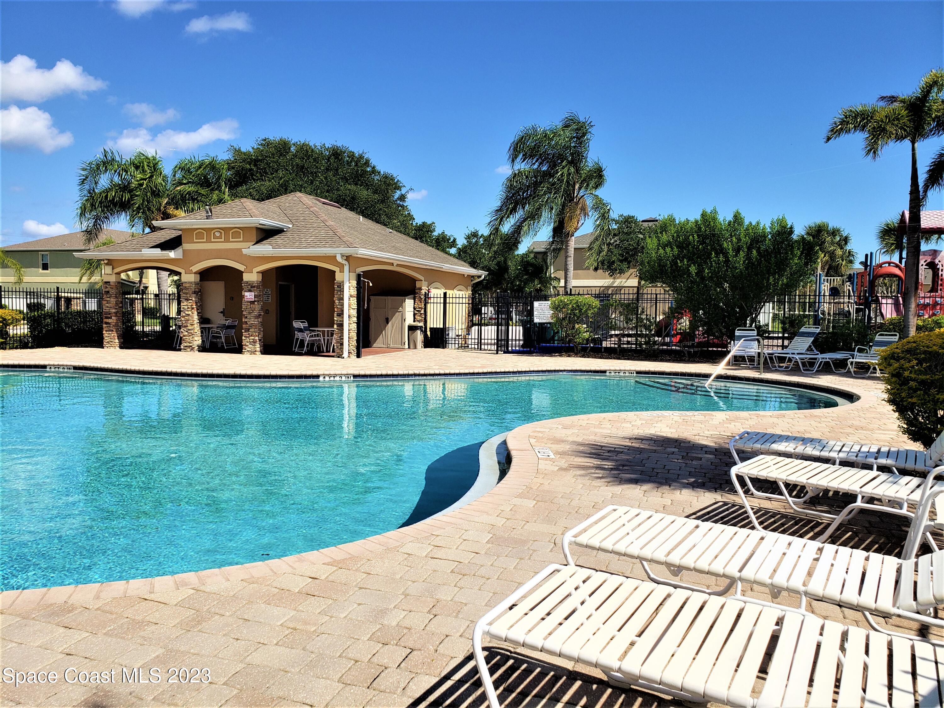 2575 Revolution Street, Unit 105 Melbourne, FL 32935 - Photo 27 of 38 a view of a house with a yard