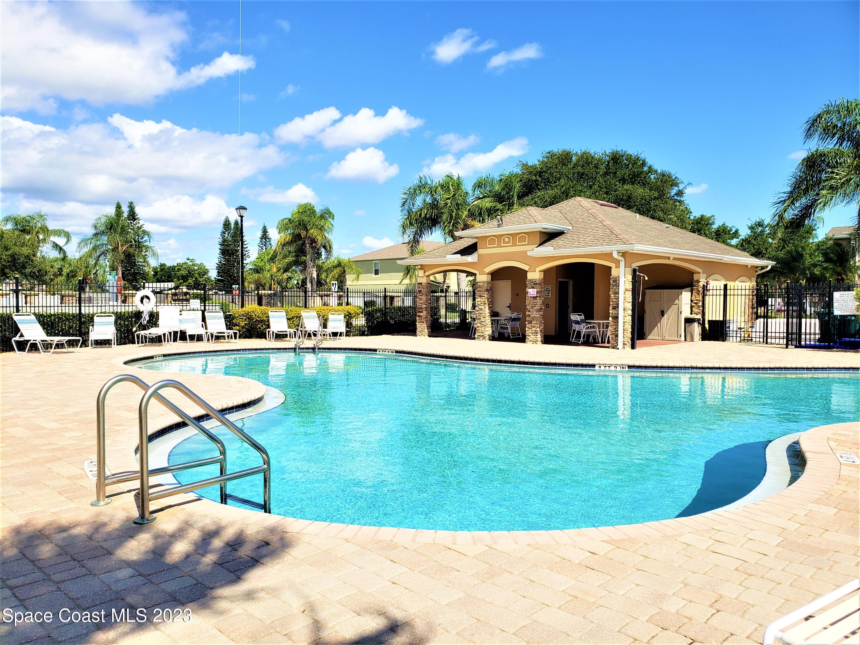 2575 Revolution Street, Unit 105 Melbourne, FL 32935 - Photo 28 of 38 a front view of a house with garden