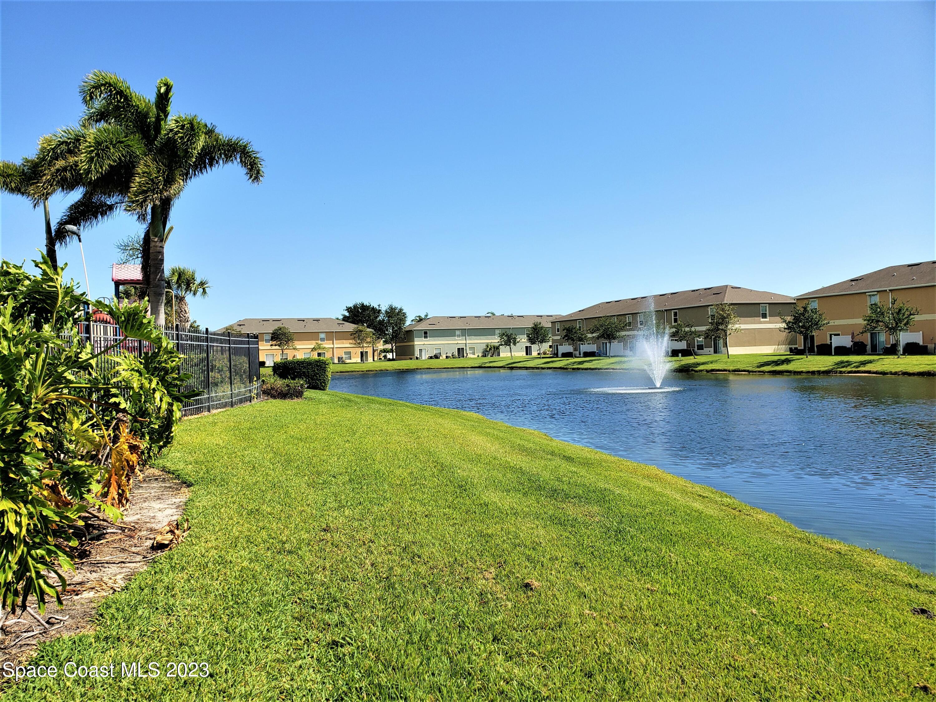 2575 Revolution Street, Unit 105 Melbourne, FL 32935 - Photo 31 of 38 a view of a lake with houses