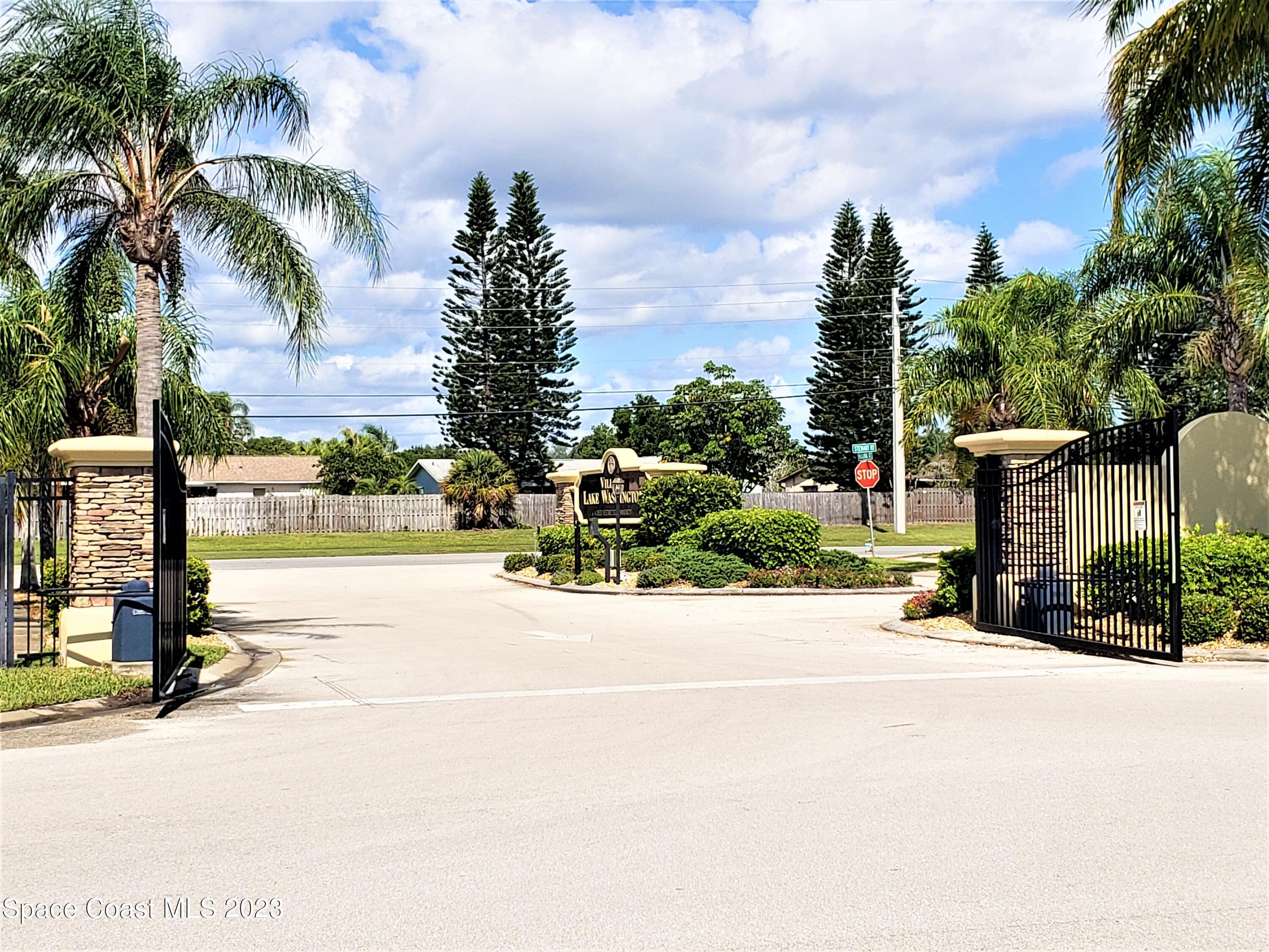 2575 Revolution Street, Unit 105 Melbourne, FL 32935 - Photo 33 of 38 a view of a street with palm trees