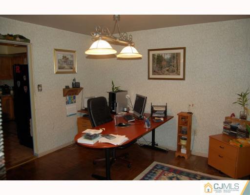 48 Pinecrest Road Somerset, NJ 08873 - Photo 6 of 10 a workspace with furniture and chandelier