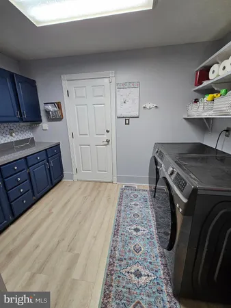 a kitchen with a stove and cabinets