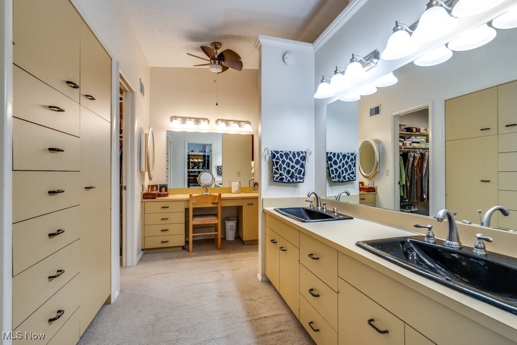 3404 South Smith Road Fairlawn, OH 44333 - Photo 24 of 37 Master suite has glamour make up table, large walk in closet, a double fanity with spacious storage and a large built in dresser with draws and linen closet and an updated bath area.