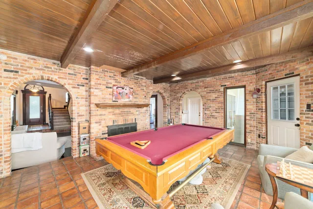 a bed room with a bed and glass door