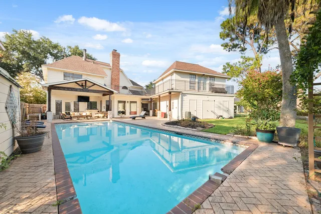 a front view of a house with a swimming pool