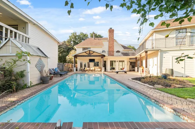 a view of a house with swimming pool