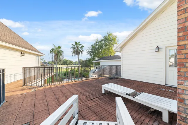 a view of a deck with wooden floor and seating space