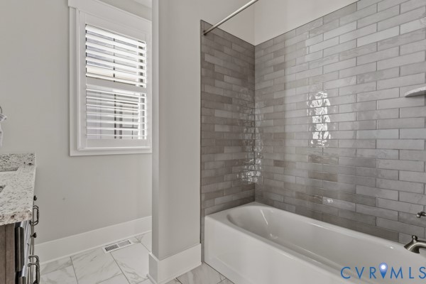 10512 River Road Chesterfield, VA 23838 - Photo 40 of 64 Bathtub with subway tile surround, shuttered windo