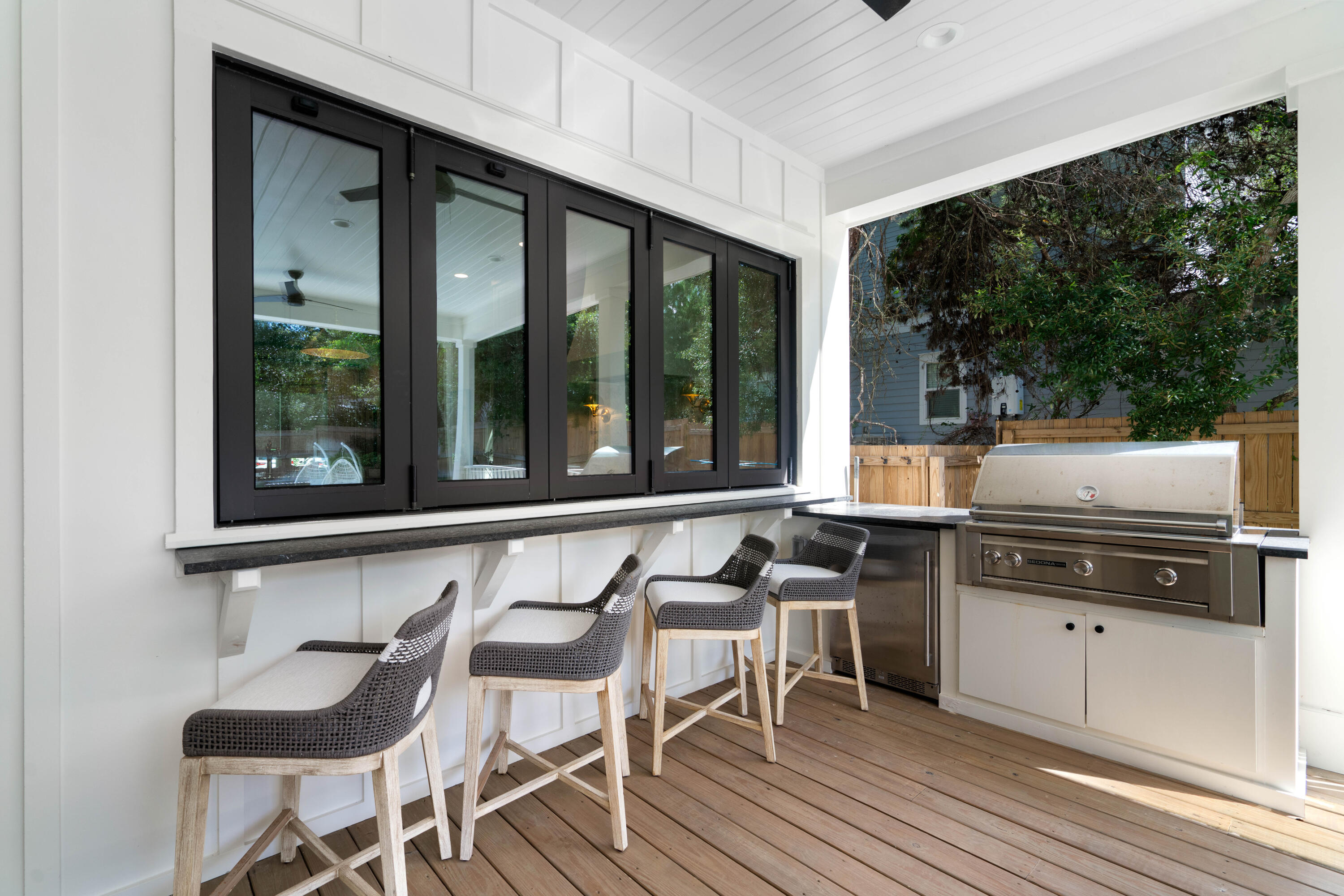 275 Clareon Dr Inlet Beach Inlet Beach, FL 32461 - Photo 60 of 76 a kitchen with a stove a sink and chairs