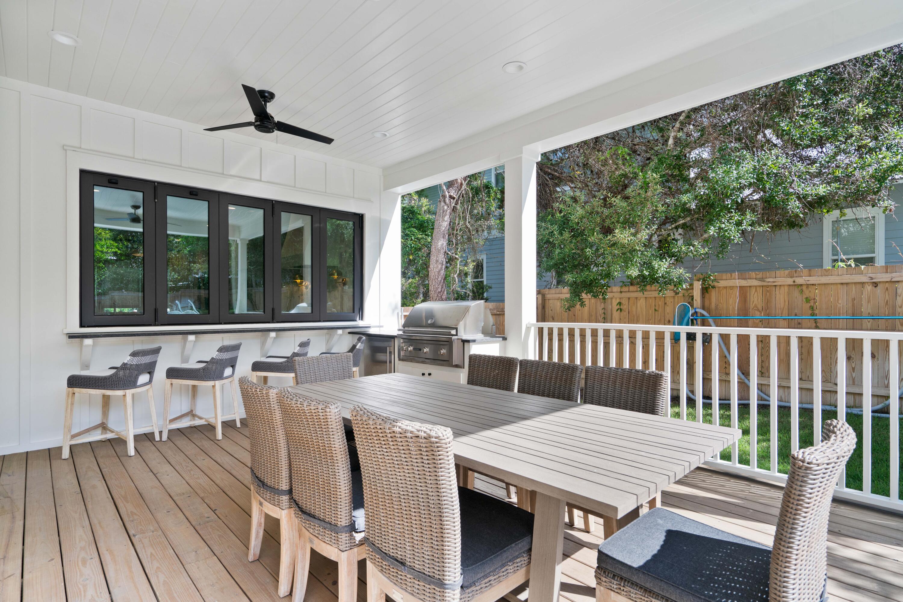 275 Clareon Dr Inlet Beach Inlet Beach, FL 32461 - Photo 61 of 76 a view of a dining room with furniture large windows and wooden floor