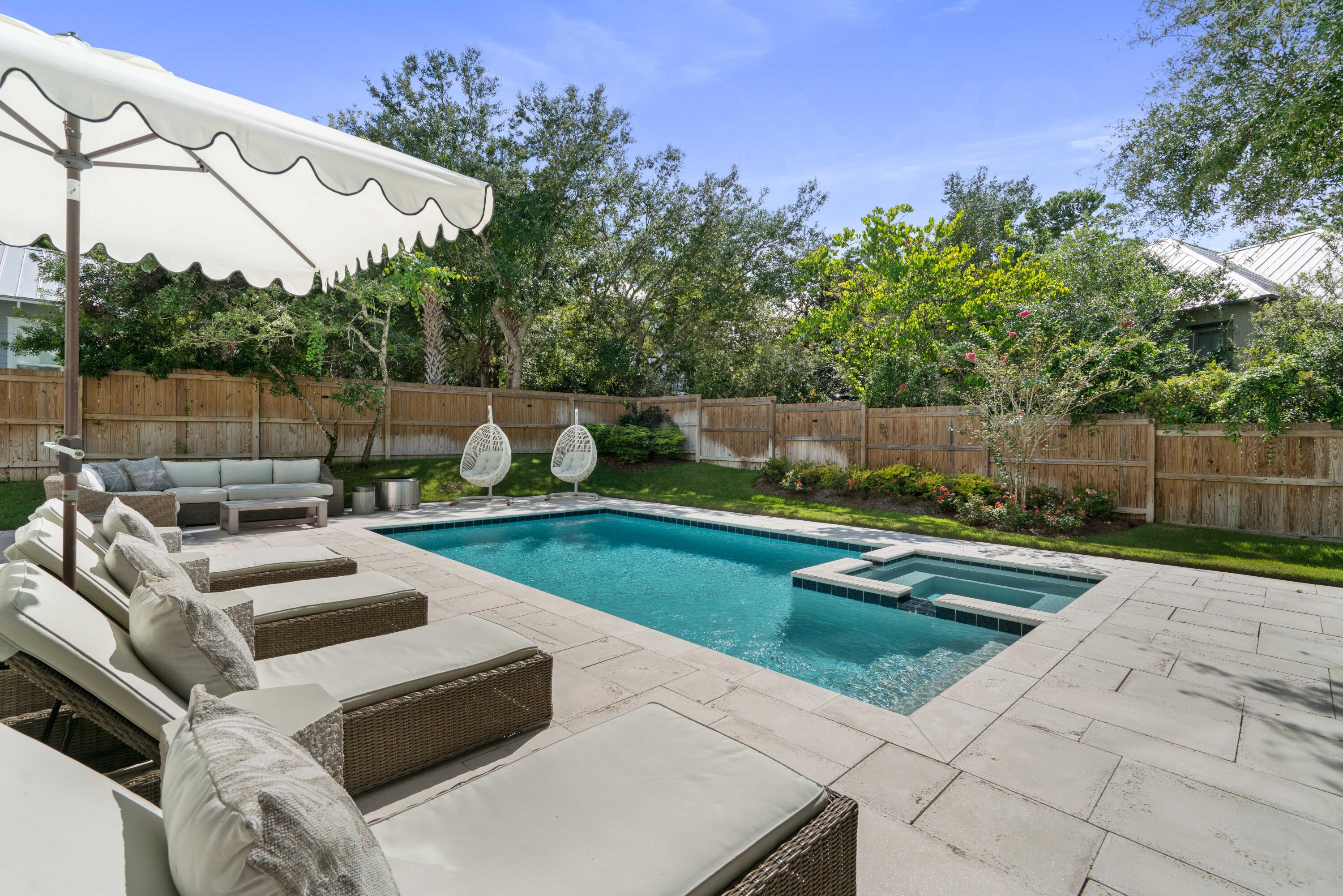 275 Clareon Dr Inlet Beach Inlet Beach, FL 32461 - Photo 64 of 76 a view of a backyard with couches table and chairs