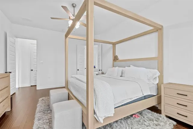 a bedroom with a bed and a dresser