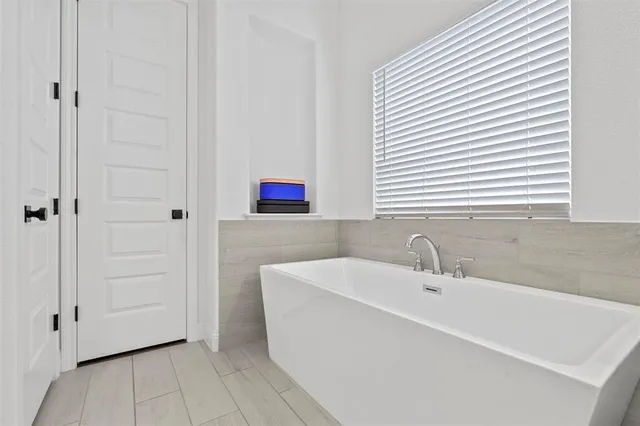 a bathroom with a sink and a bathtub