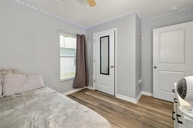 a view of a storage & utility room with a refrigerator