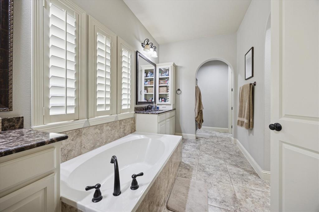 580 Butchart Drive Prosper, TX 75078 - Photo 18 of 40 Bathroom with a bath and vanity
