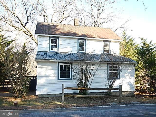 2060 Flag Marsh Road Mount Airy, MD 21771 - Photo 1 of 11 a front view of a house with a tree