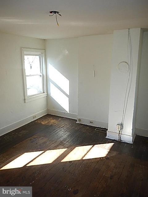 2060 Flag Marsh Road Mount Airy, MD 21771 - Photo 4 of 11 an empty room with wooden floor and windows