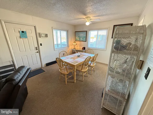 a view of a livingroom with furniture and window