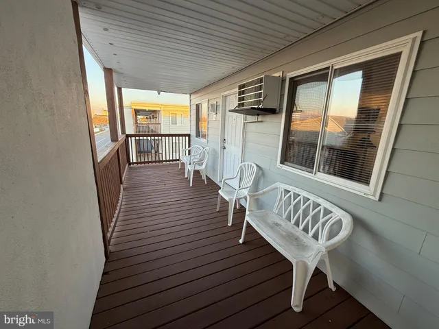 a view of a two chairs in the balcony