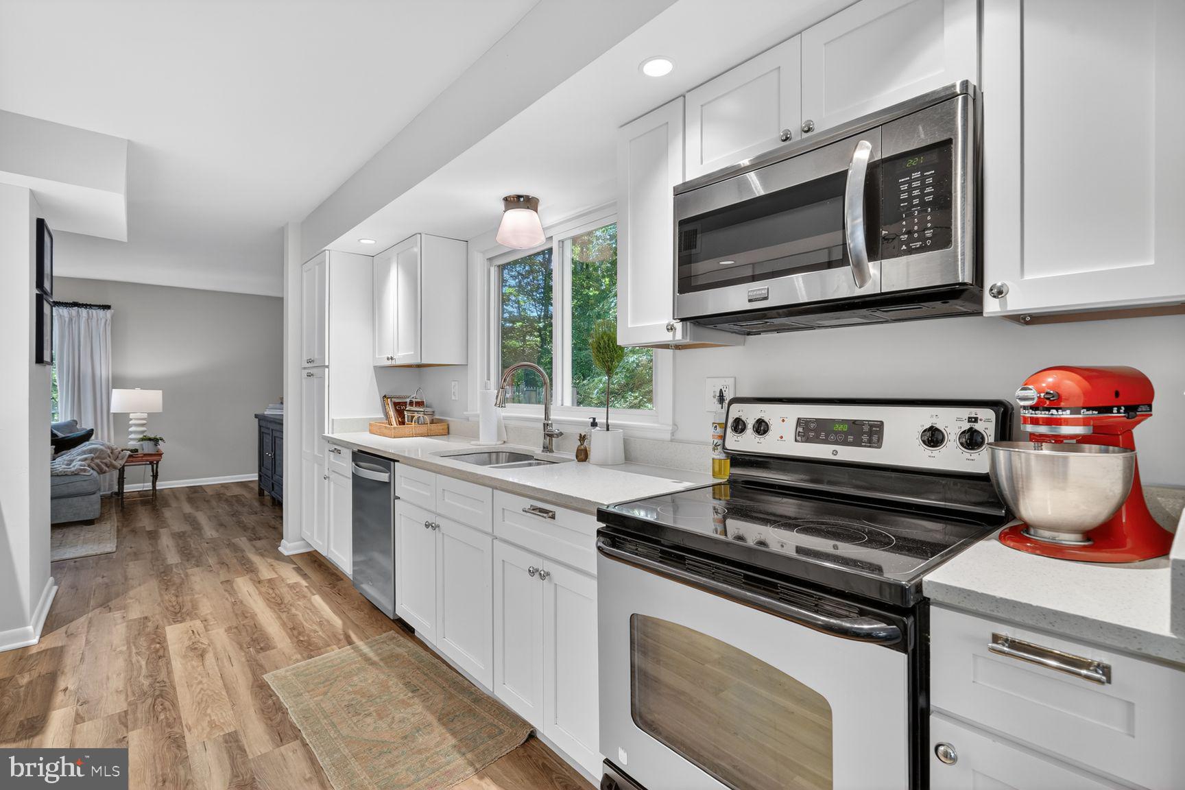 11201 Wedge Drive Reston, VA 20190 - Photo 8 of 31 a kitchen with a stove and a microwave