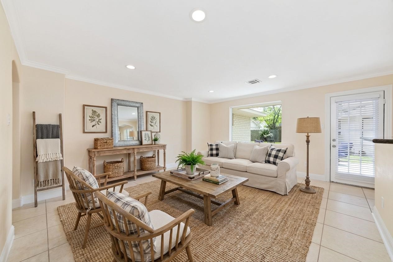 5643 Cheena Drive Houston, TX 77096 - Photo 13 of 32 a living room with furniture and a fireplace