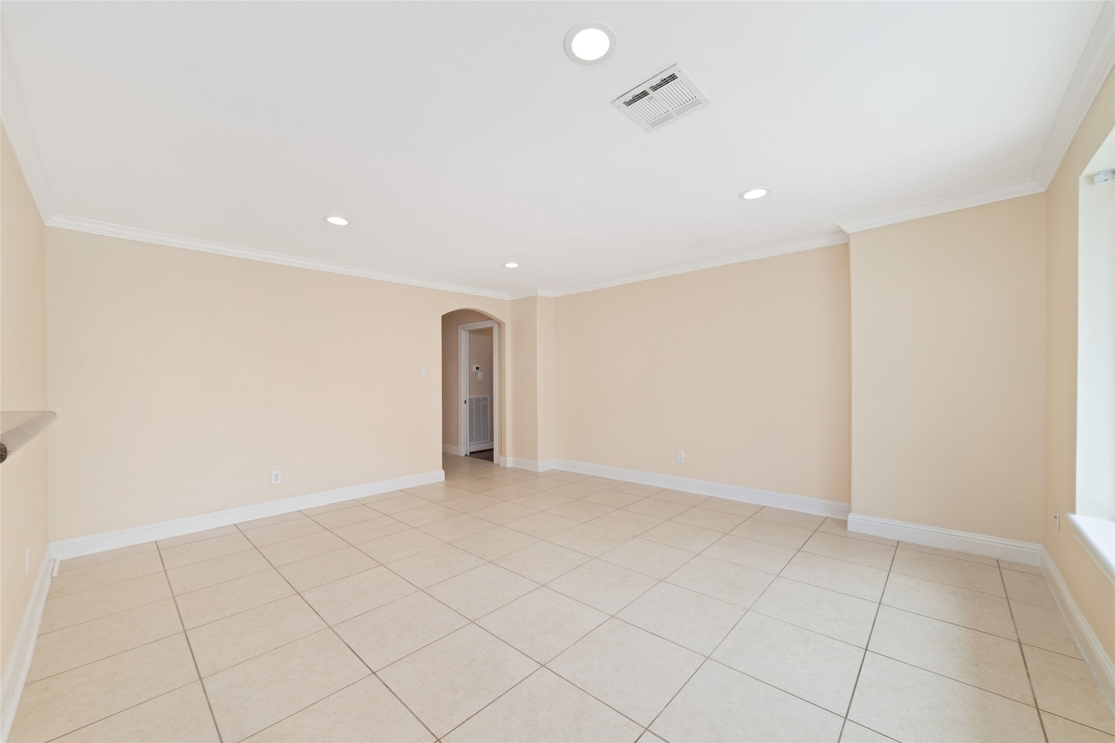 5643 Cheena Drive Houston, TX 77096 - Photo 16 of 32 an empty room with white walls and tiles