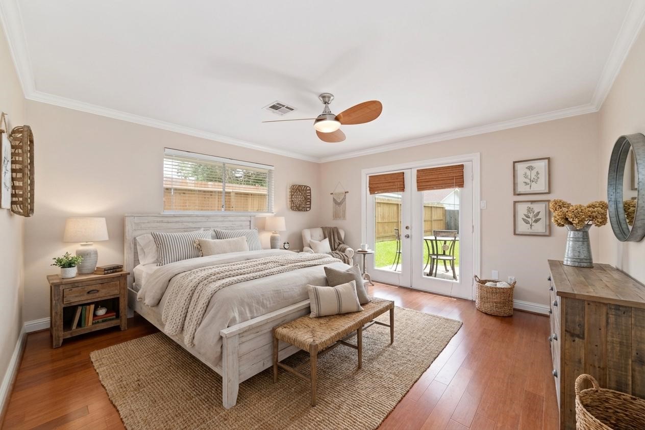 5643 Cheena Drive Houston, TX 77096 - Photo 17 of 32 a bedroom with a bed and wooden floor