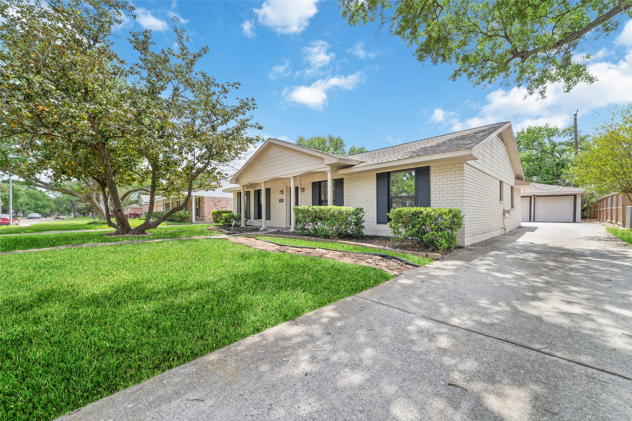 5643 Cheena Drive Houston, TX 77096 - Photo 2 of 32 a front view of a house with a yard