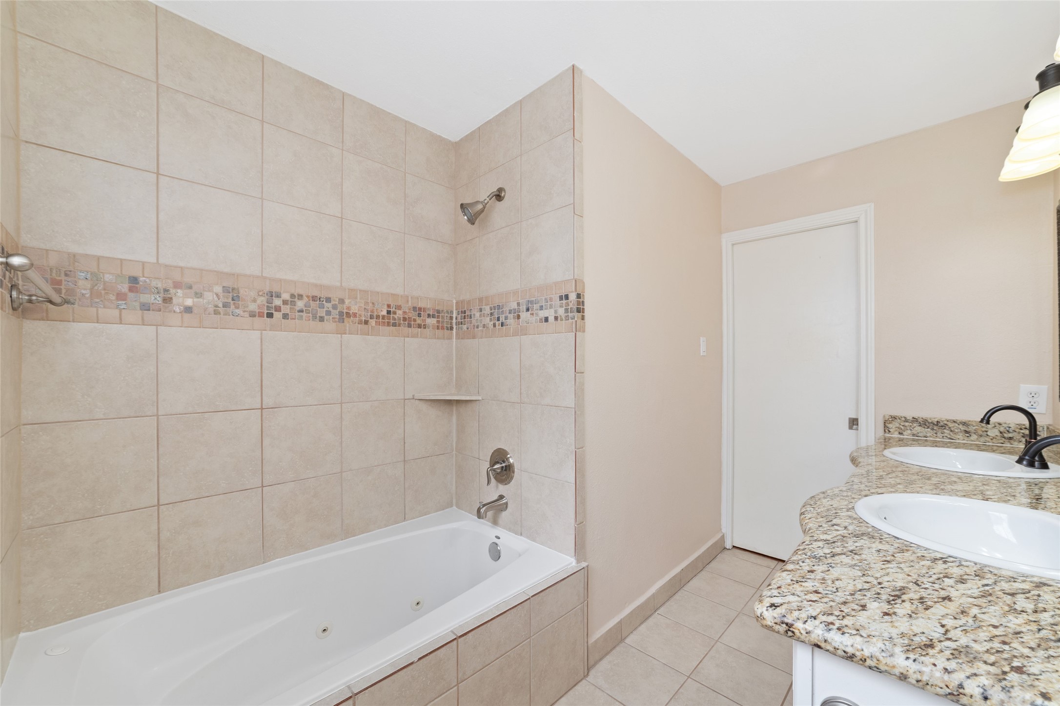 5643 Cheena Drive Houston, TX 77096 - Photo 29 of 32 a bathroom with a granite countertop bathtub sink vanity and shower