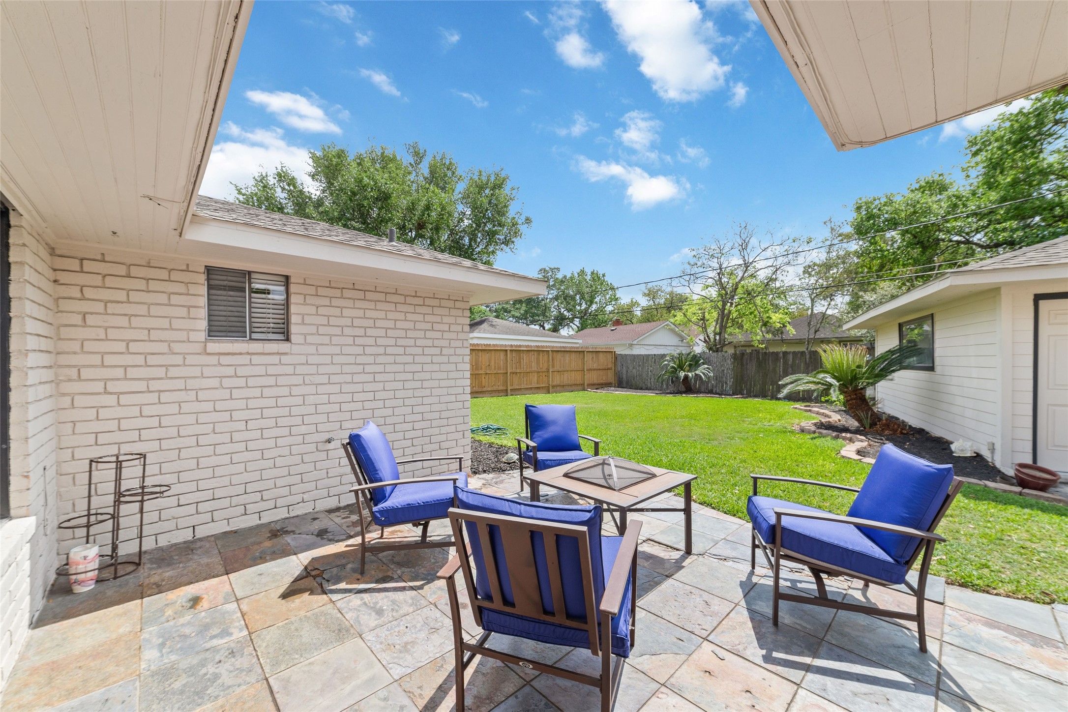 5643 Cheena Drive Houston, TX 77096 - Photo 31 of 32 a patio with table and chairs