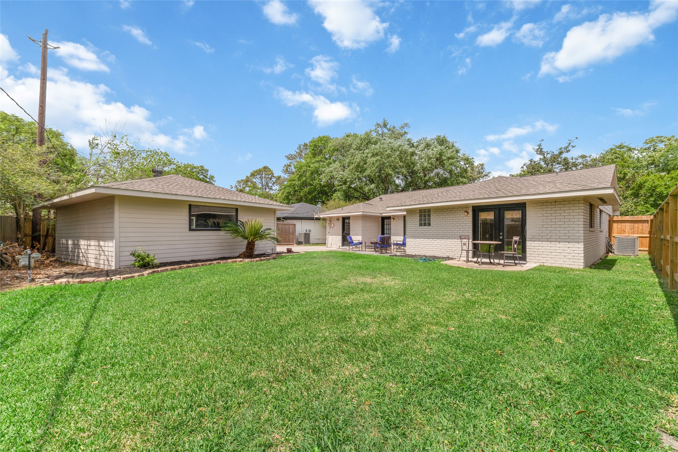 5643 Cheena Drive Houston, TX 77096 - Photo 32 of 32 a front view of a house with a garden