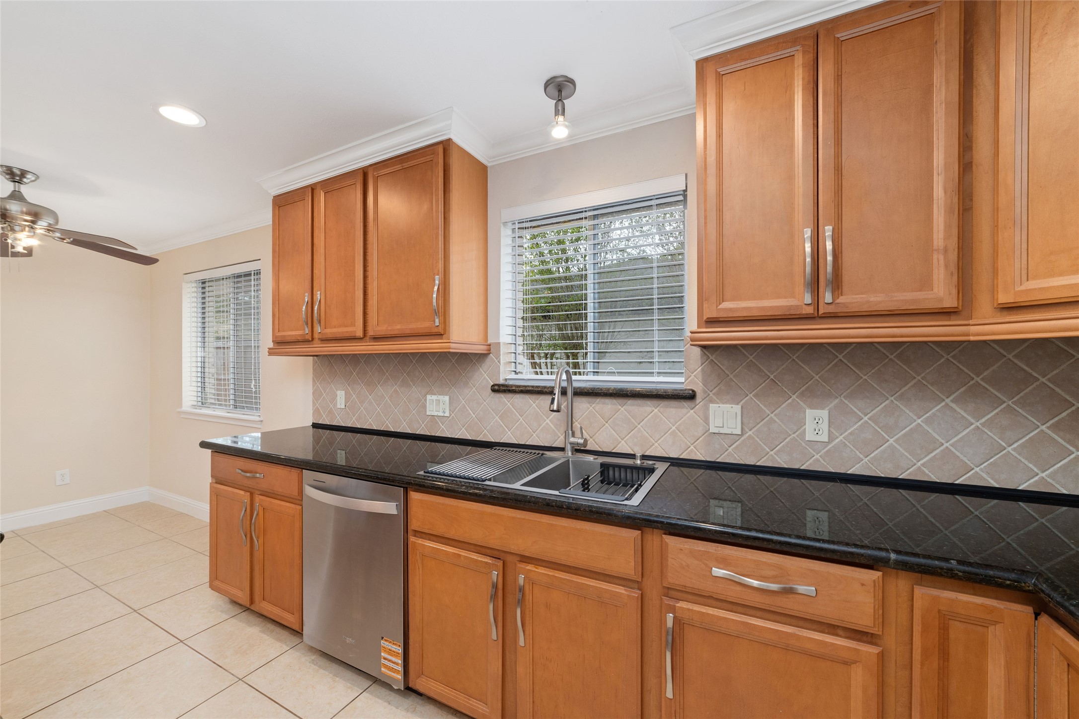 5643 Cheena Drive Houston, TX 77096 - Photo 9 of 32 a kitchen with granite countertop a sink and cabinets