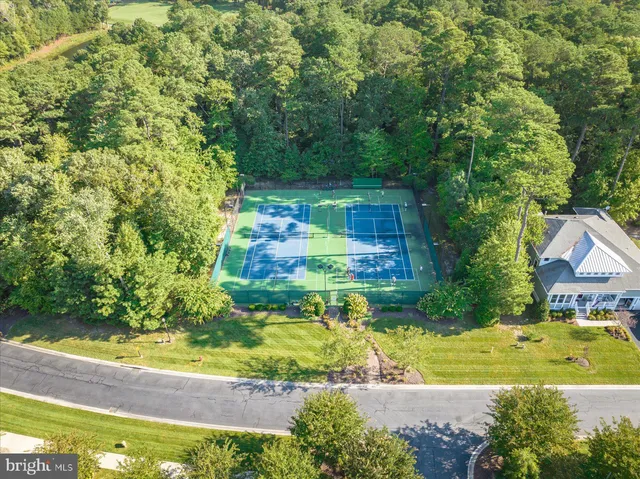 a view of house with garden space and swimming pool