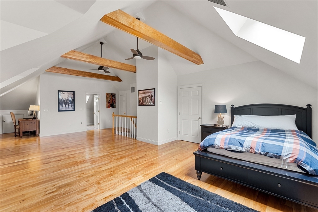 37 Old Planters Road Beverly, MA 01915 - Photo 34 of 42 a bedroom with furniture and wooden floor