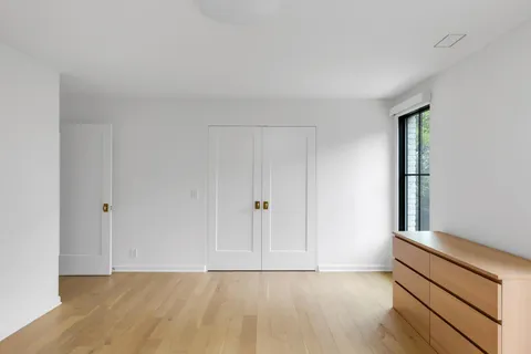 a view of an empty room and wooden floor
