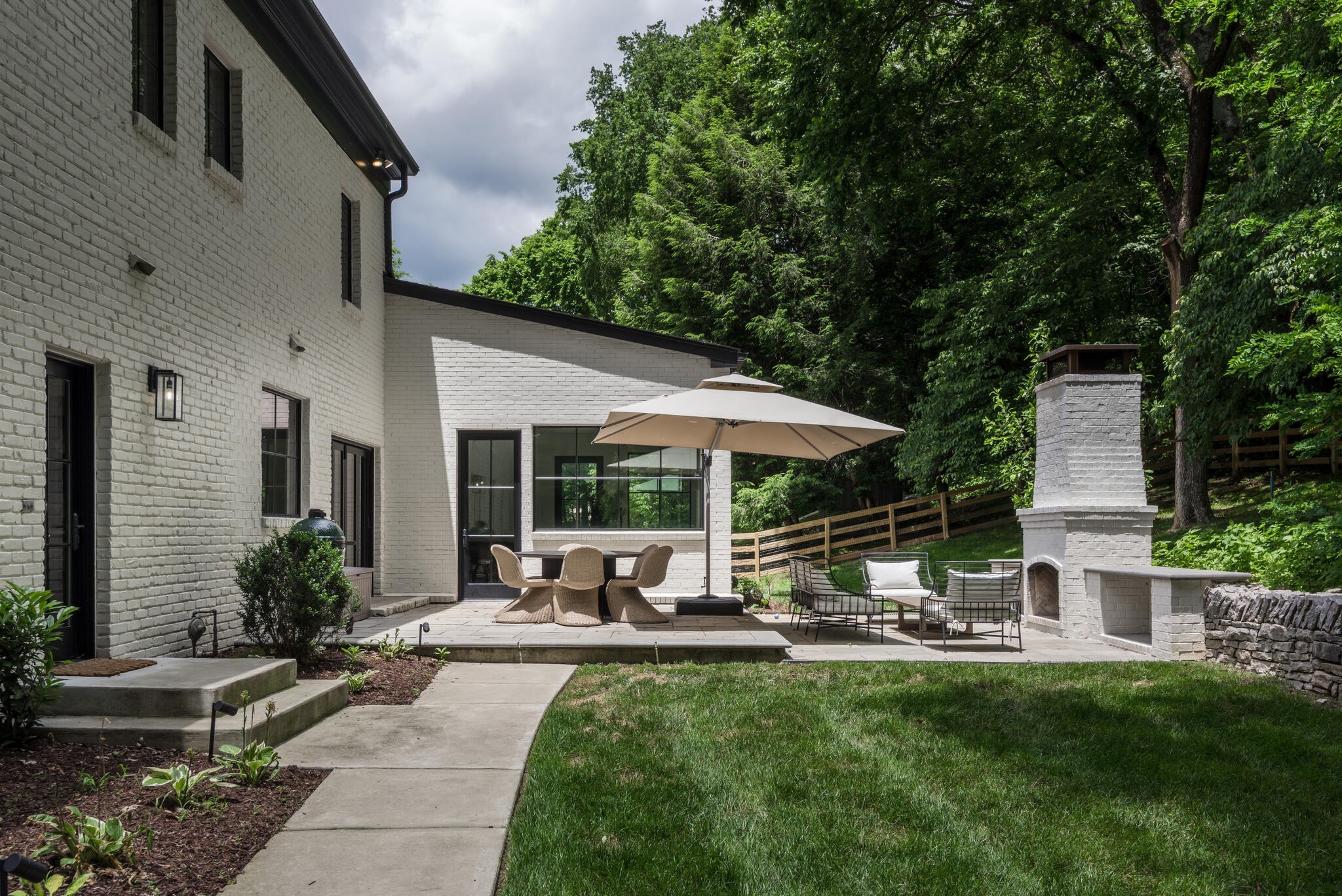 1005 Scramblers Knob Franklin, TN 37069 - Photo 33 of 41 a view of a patio with table and chairs under an umbrella