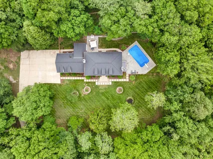 an aerial view of a house with garden space
