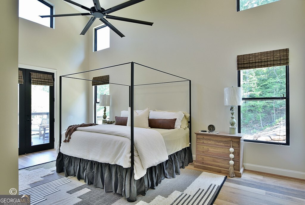 299 Coldivees Road Hamilton, GA 31811 - Photo 15 of 46 a bedroom with a bed and wooden floor