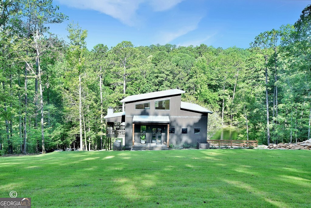 299 Coldivees Road Hamilton, GA 31811 - Photo 2 of 46 a view of a house with a yard