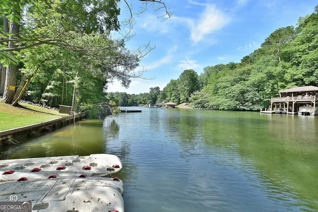 a kitchen with stainless steel appliances a sink stove and cabinets